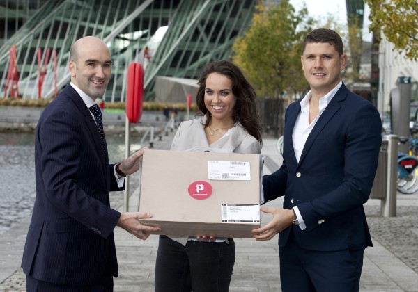  Barry Keegan, (left) Sales Director, Payzone Ireland and Danny Hughes, CEO at Parcel Connect. hand over the Parcel Connect package to online shopper Emma