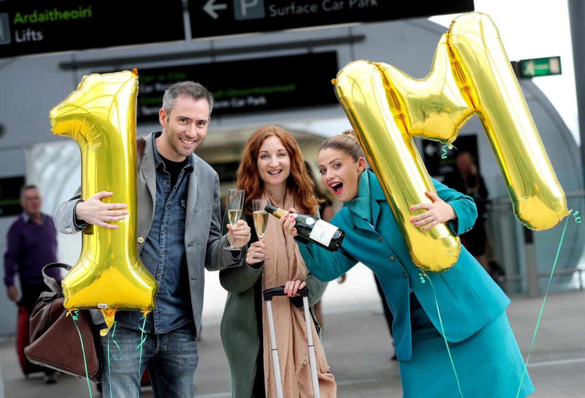 17/08/2016 NO REPRO FEE, MAXWELLS DUBLIN Aer Lingus’ one millionth transatlantic passenger Ciarán Foy and Olwen Kelleghan today became Aer Lingus’ one millionth transatlantic passengers. The married couple from Dublin, but currently residing in Los Angeles, were greeted by Aer Lingus crew member Sarah Jane Maples with celebratory champagne, a complimentary pair of return flights to any Aer Lingus destination and a business-class upgrade as they checked-in to their flight to Los Angeles, California in Dublin Airport’s Terminal 2. Aer Lingus’ new direct route from Dublin to LA launched in May as part of the airline’s largest ever transatlantic expansion which also includes new direct routes to Newark, New Jersey and Hartford, Connecticut commencing this September. PIC: NO FEE, MAXWELLPHOTOGRAPHY.IE